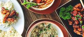 Assortment of savory food on wood table